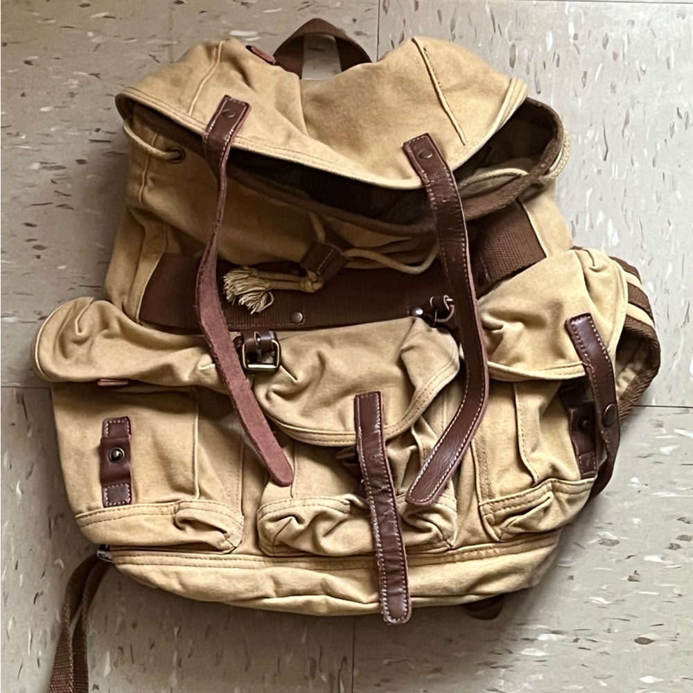 tan vagabond traveler bookbag